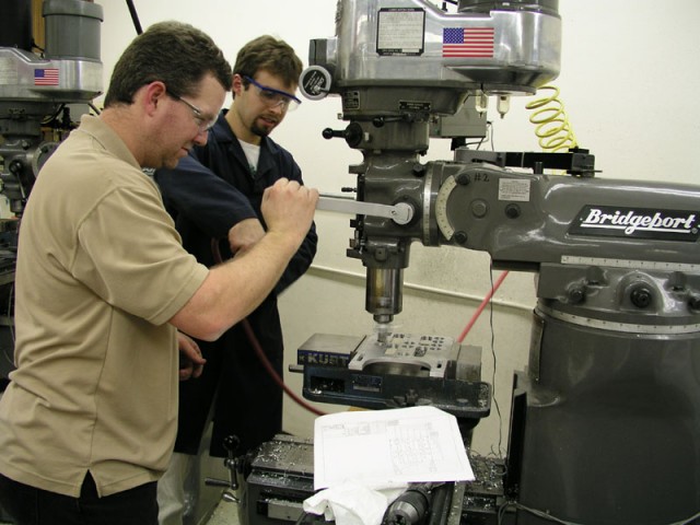 Bob and Douglas at work on a milling machine.