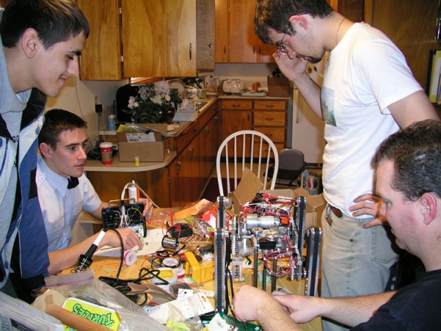 The team working on J-Walker's electronics.