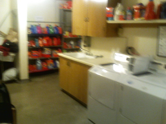 Inside the laundry room.  The machines all look nice but many of them eat quarters for breakfast.